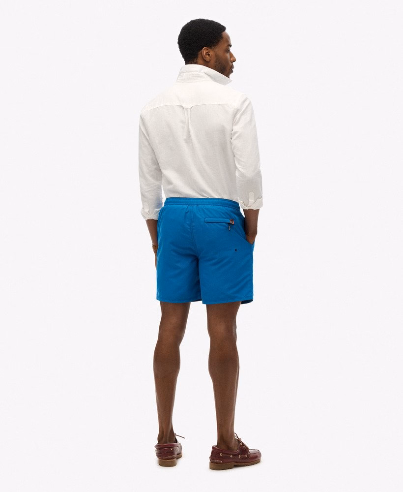 Superdry Herren Premium EMB 17 Badeshorts mit Stickerei in Twilight Blue - Blau Superdry Herren Premium EMB 17 Badeshorts mit Stickerei in Twilight Blue - Blau