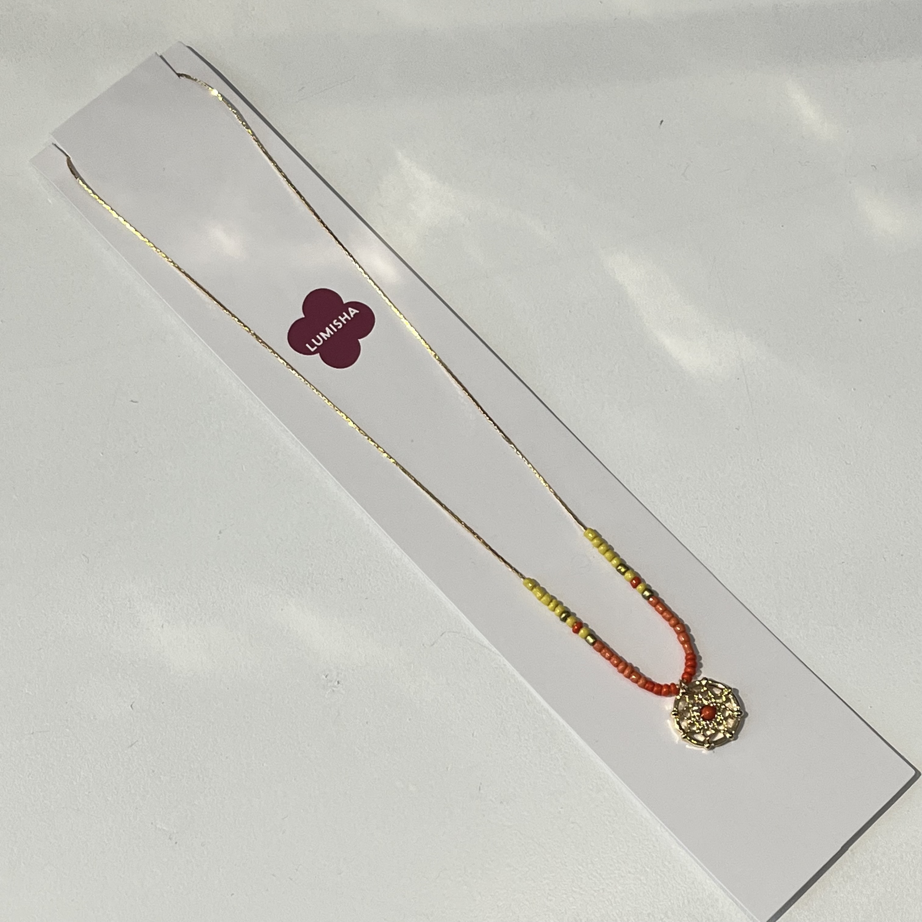 Lumisha Xana Kette mit Medaille - Orange & Gelb