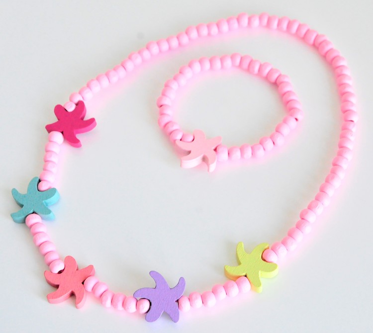 9kMgbETYxLFBEan-1 KisMe Halskette & Armband Set aus Holz in Rosa - Seesterne Bunt